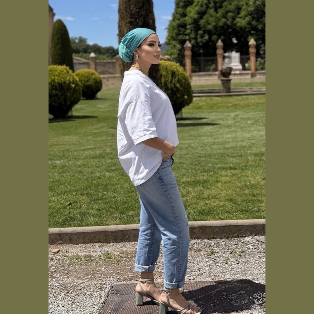 Side view of MIMOUNT COUTURE Brisa Jade chiffon turban styled for summer casual wear